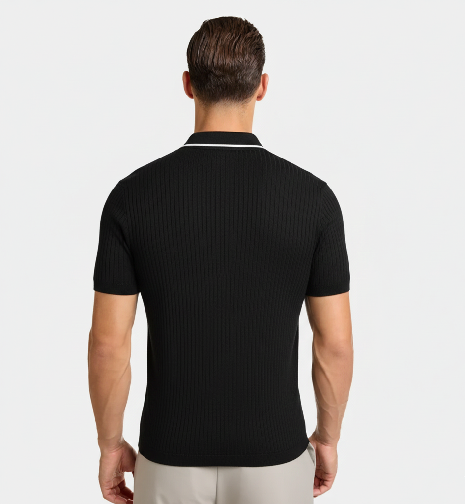 Man wearing a black ribbed polo shirt on a white background